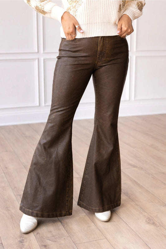  High-Rise Leather Flare Pants are a chic and edgy addition to your wardrobe. Designed with a fitted silhouette through the waist and hips, these pants feature a high-rise waistline, a zipper fly, and a dramatic flared leg. 