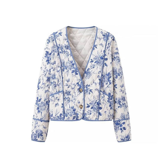 Blue  Floral Quilted Jacket is a timeless and elegant piece that offers both style and comfort. Featuring a classic blue-and-white floral pattern, this lightweight quilted jacket is perfect for layering during cooler seasons. 