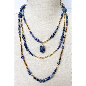 Blue beaded necklace three-layered Boho design that features a harmonious blend of gold chains and exquisite stone beading. 