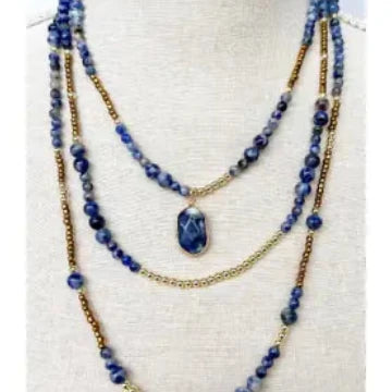 Blue beaded necklace three-layered Boho design that features a harmonious blend of gold chains and exquisite stone beading. 
