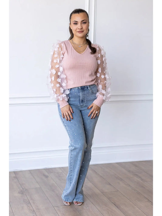 Floral Sleeve Top brings a touch of elegance and charm to your wardrobe. Designed with sheer puff sleeves adorned with 3D floral appliqués and a soft V-neckline.