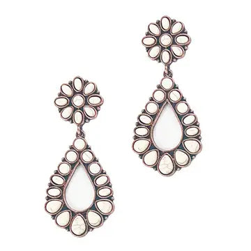 Pair of earrings with floral and teardrop designs on a white background
