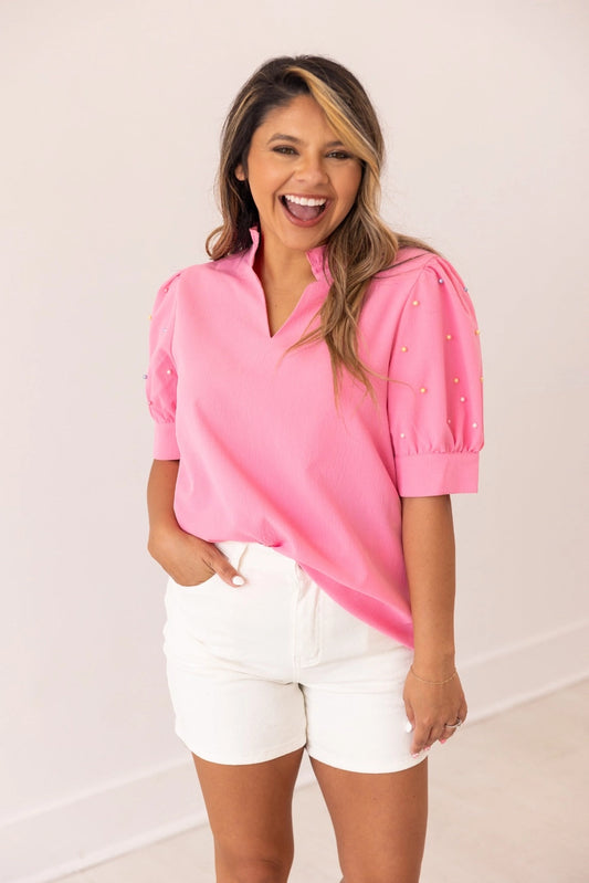 Embellished Blouse is a playful yet sophisticated choice for any occasion. Featuring puff sleeves with delicate embellishments and a split neckline.
