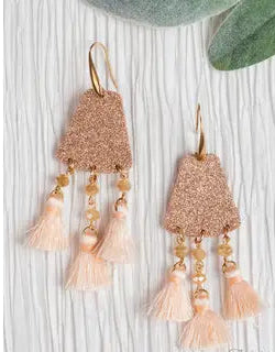 Rose gold tassel earrings on a white background with 'Ashlyn Rose' branding.