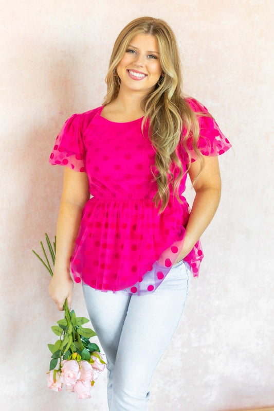  Polka Dot Peplum Blouse is a chic and versatile piece designed for effortless transitions from day to date night. Featuring a crew neck, flattering peplum silhouette, and an elastic waistband.