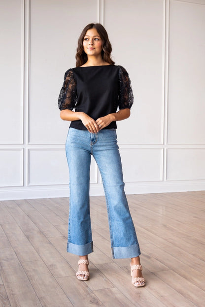 Lace Puff Sleeve Top is a perfect combination of elegance and simplicity. Featuring delicate sheer lace puff sleeves and a classic boat neckline.