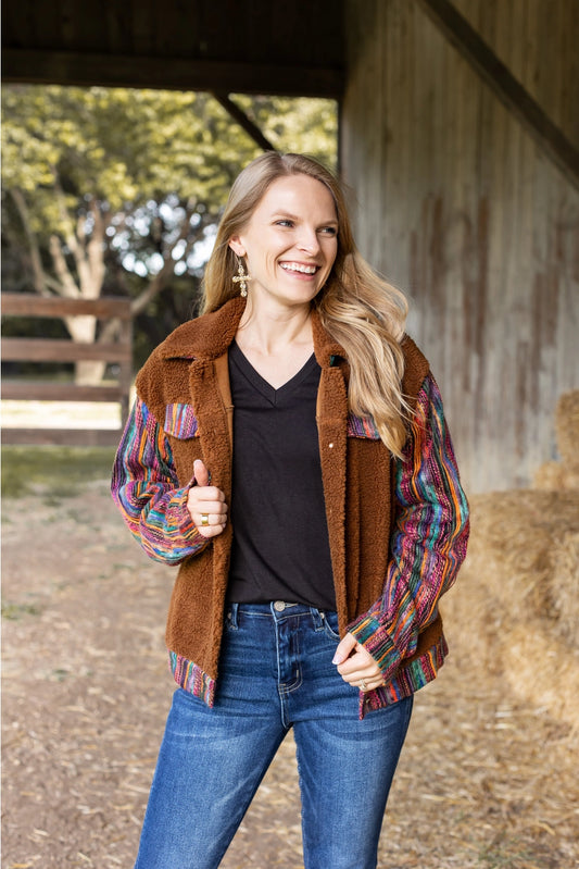  Sherpa Jacket with a cozy and stylish piece that combines comfort with bold, colorful accents. 