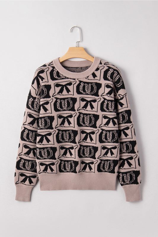 Western Print Sweater makes a bold statement with its unique bows and horseshoes pattern.