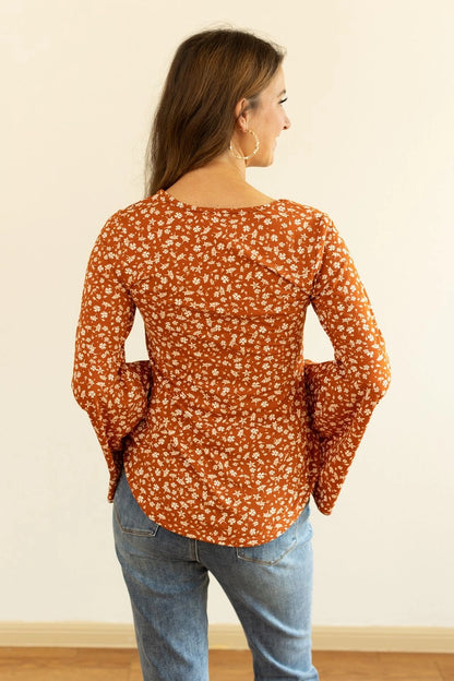 Floral Bell Sleeve Top is a charming blend of comfort and boho-inspired style. Featuring a relaxed fit, high stretch fabric, and unlined construction.