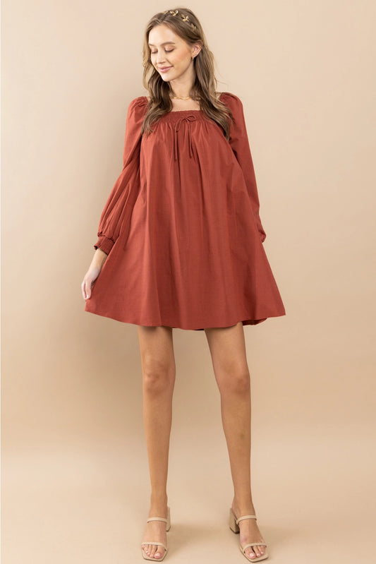 Rust Smocked Shoulder Dress Featuring smocking details on the shoulders.