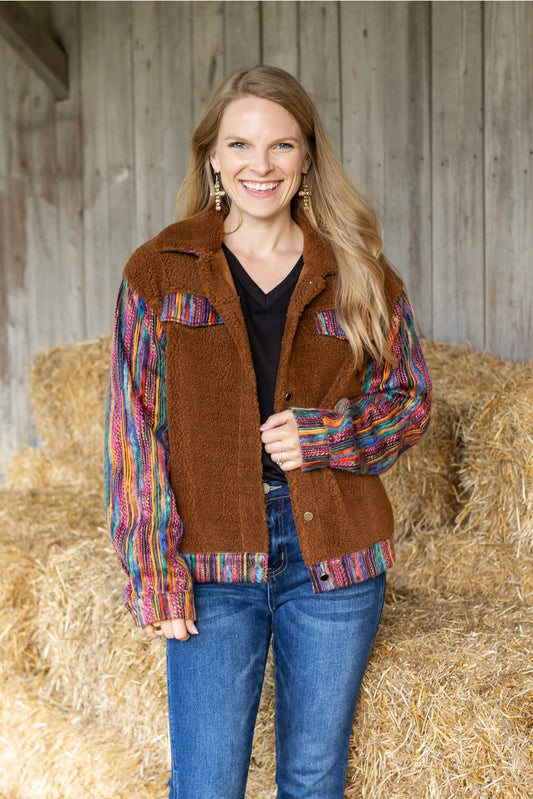  Sherpa Jacket with a cozy and stylish piece that combines comfort with bold, colorful accents. 