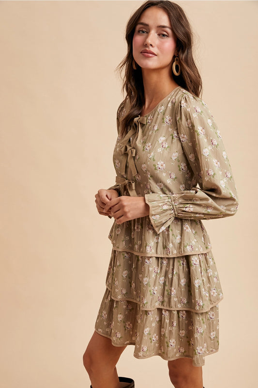  Bow Tie Floral Dress is a playful and feminine piece that combines charm and sophistication. 