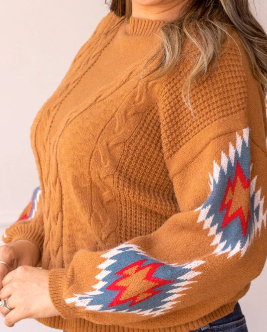  Cable Knit Aztec Sweater brings together cozy warmth and eye-catching design. Featuring a relaxed fit, this sweater is crafted with classic cable-knit detailing on the body and bold Aztec-inspired patterns on the sleeves. 