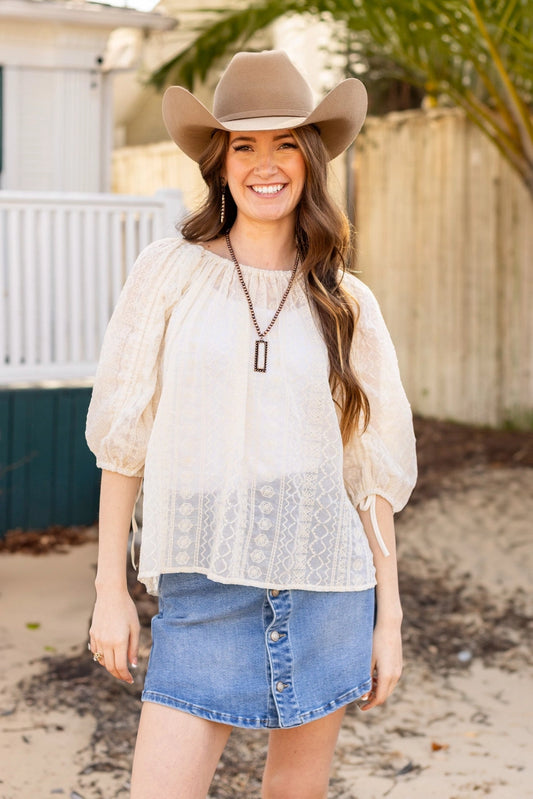 Peasant Blouse exudes effortless charm with its relaxed fit and lightweight feel. Featuring adjustable sleeves and a matching belt crafted from the same fabric.
