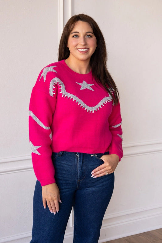  Star-Accent Sweater is a fun and vibrant addition to your wardrobe. Designed with a relaxed fit, this bold pink sweater features playful star and wave patterns in contrasting colors.