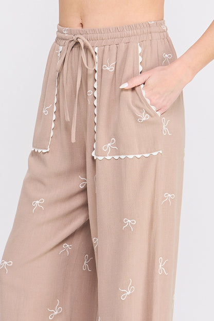Beige Bow Embroidered Palazzo Pants.