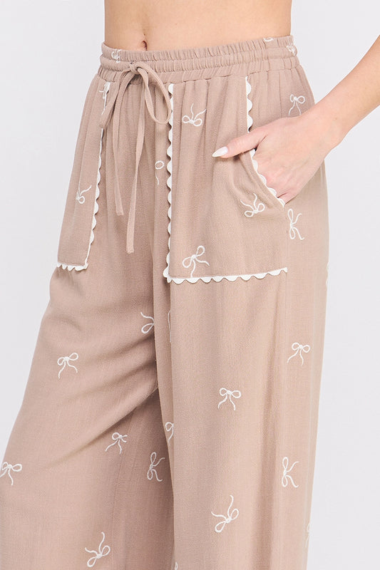 Beige Bow Embroidered Palazzo Pants.