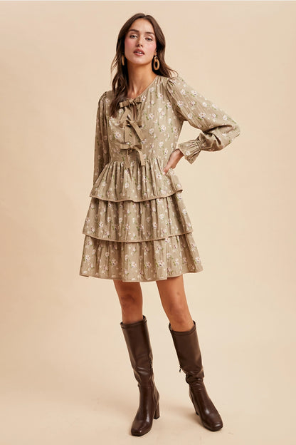  Bow Tie Floral Dress is a playful and feminine piece that combines charm and sophistication. 