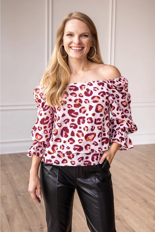  Off-Shoulder Leopard Print Top is a stylish blend of boldness and elegance. Featuring an eye-catching leopard print design.