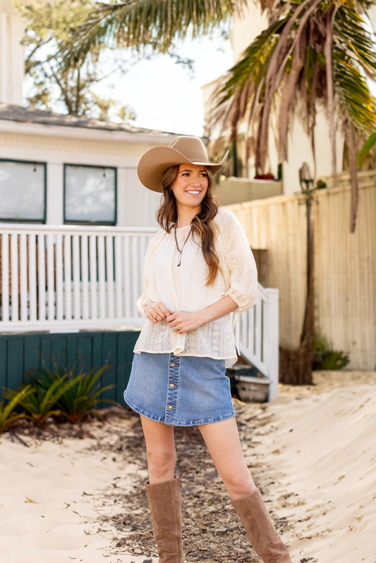Peasant Blouse exudes effortless charm with its relaxed fit and lightweight feel. Featuring adjustable sleeves and a matching belt crafted from the same fabric.