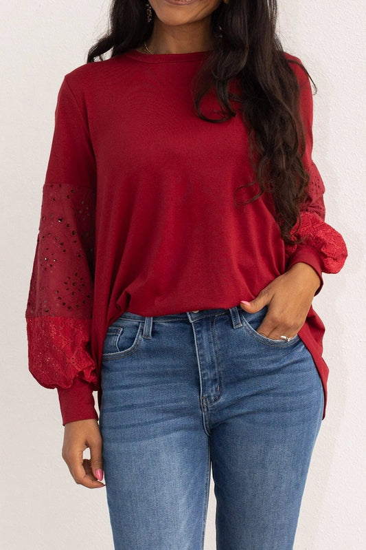 Eyelet Sleeve Top combines casual comfort with a touch of elegance. Designed with a relaxed fit, this top features intricate eyelet lace balloon sleeves.