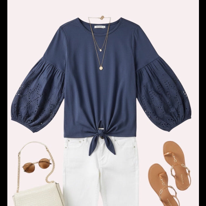 Blue top with white pants, purse and sandals