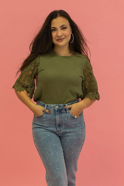 Lace Sleeve Top effortlessly combines comfort and elegance. Featuring a relaxed fit and delicate lace sleeves.