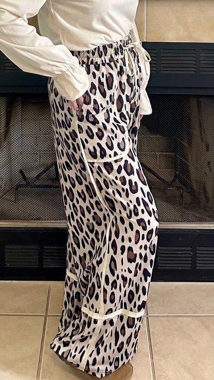 Woman standing in a living room with a decorated fireplace