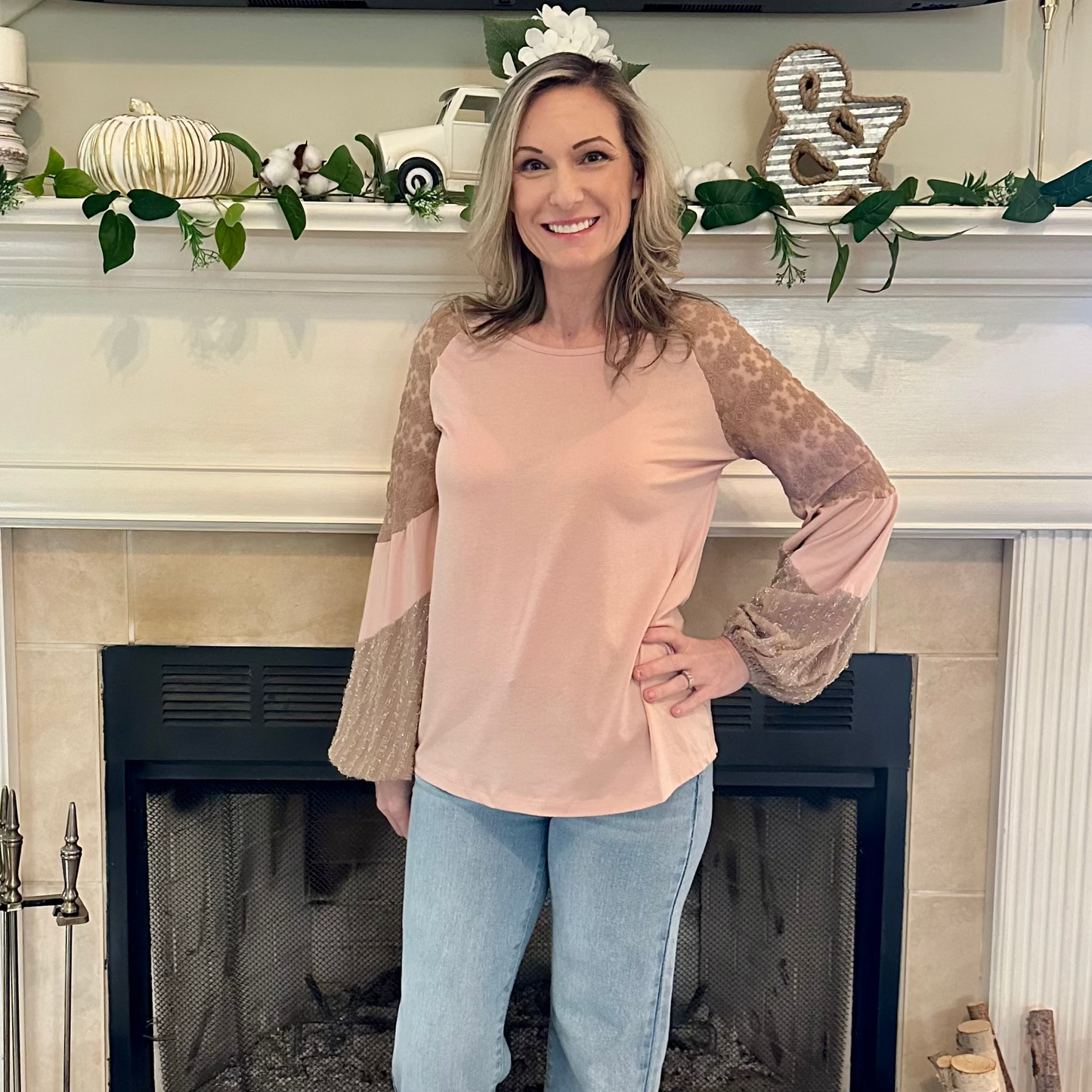 Lace Sleeve Top is a perfect blend of comfort and elegance. Featuring a relaxed fit, this top is designed with delicate lace balloon sleeves.