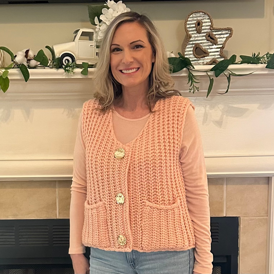  Knit Button-Front Vest is a cozy and stylish layering piece, perfect for adding texture to your outfit. 