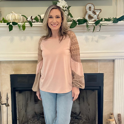 Lace Sleeve Top is a perfect blend of comfort and elegance. Featuring a relaxed fit, this top is designed with delicate lace balloon sleeves.