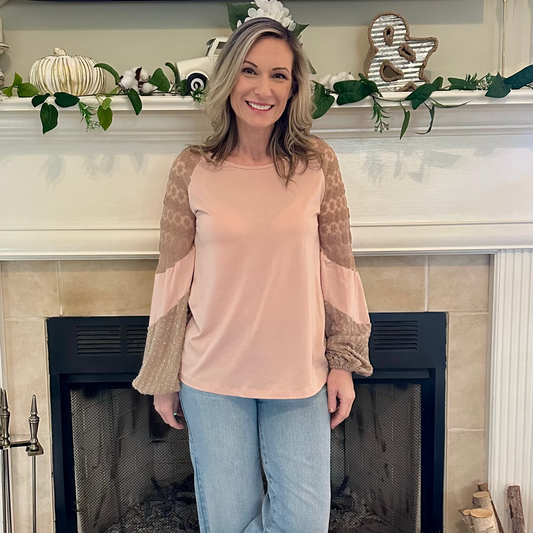 Lace Sleeve Top is a perfect blend of comfort and elegance. Featuring a relaxed fit, this top is designed with delicate lace balloon sleeves.