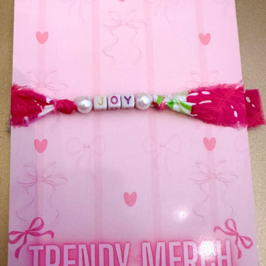 Pink with decorative elements and 'Trendy Merch' branding on a gold background