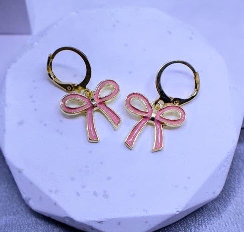 Pink and Gold bow-shaped earrings.