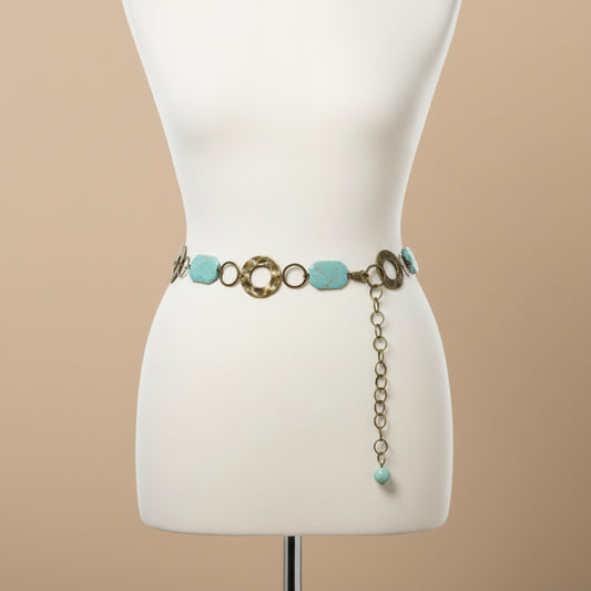 Belt with turquoise stones and gold-like accents on a mannequin 