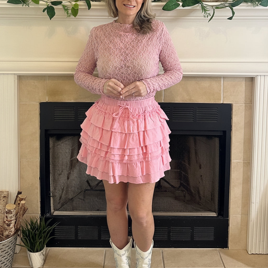 Pink Delicate Lace Mock Neck Top is a stunning piece that exudes elegance and femininity. Crafted from sheer floral lace.