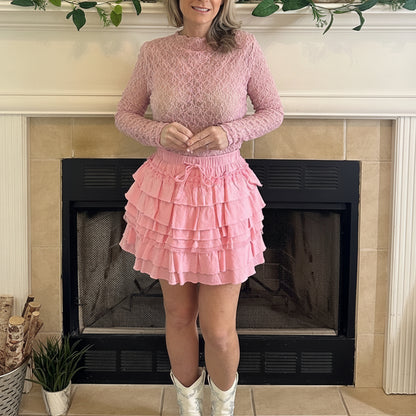 Pink Delicate Lace Mock Neck Top is a stunning piece that exudes elegance and femininity. Crafted from sheer floral lace.