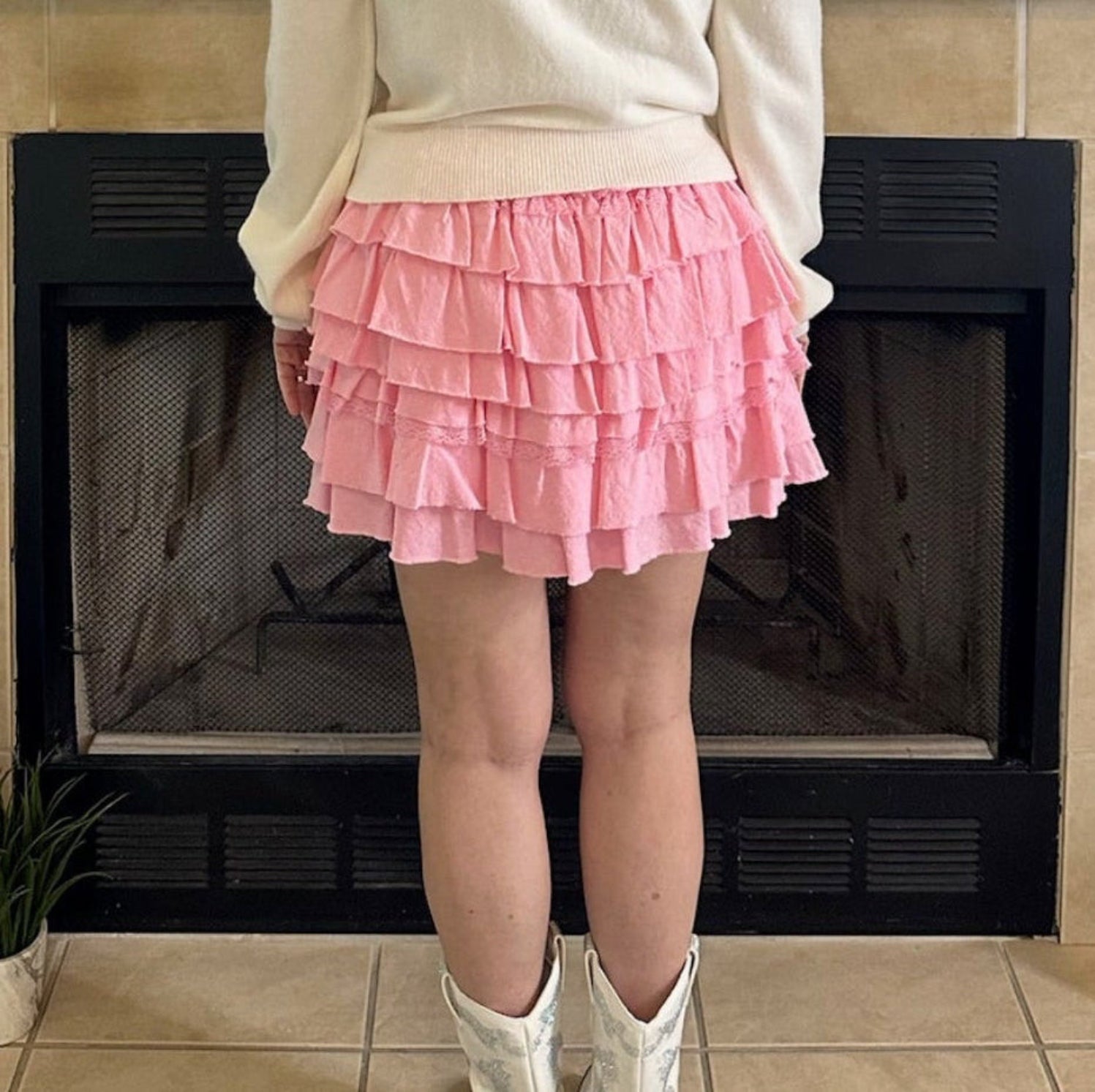 Pink Tiered Ruffle Mini Skirt is the epitome of feminine charm and playful style. Featuring an elastic waistband for a secure and adjustable fit.