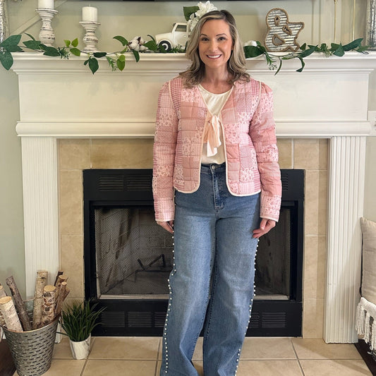 Reversible Quilted Jacket is a versatile and stylish layering piece that combines comfort with timeless charm. Crafted from voile fabric, this jacket features a quilted, patchwork print design and a flattering V-neckline. 