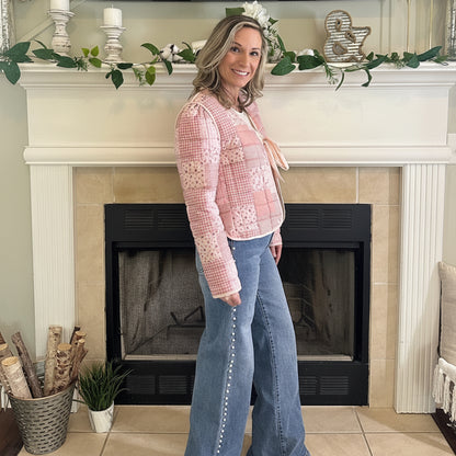 Reversible Quilted Jacket is a versatile and stylish layering piece that combines comfort with timeless charm. Crafted from voile fabric, this jacket features a quilted, patchwork print design and a flattering V-neckline. 