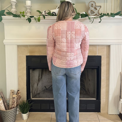 Reversible Quilted Jacket is a versatile and stylish layering piece that combines comfort with timeless charm. Crafted from voile fabric, this jacket features a quilted, patchwork print design and a flattering V-neckline. 