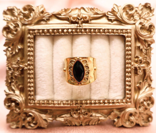 Ring is a radiant celebration of bold elegance and timeless femininity. With a marquise-shaped black stone at its heart.