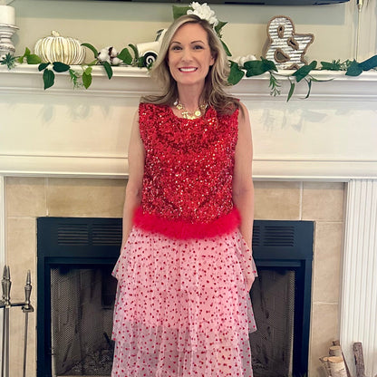 Heart Tiered Tulle Skirt is a whimsical and romantic piece perfect for adding a playful touch to your wardrobe. Featuring multiple layers of soft tulle adorned with delicate heart patterns.