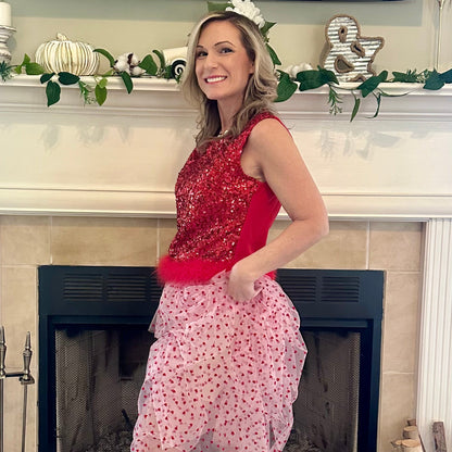 Heart Tiered Tulle Skirt is a whimsical and romantic piece perfect for adding a playful touch to your wardrobe. Featuring multiple layers of soft tulle adorned with delicate heart patterns.