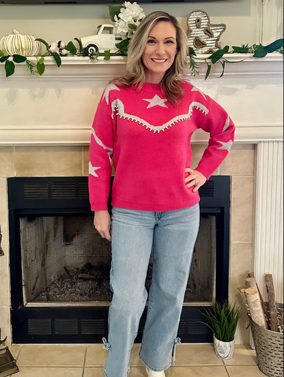  Star-Accent Sweater is a fun and vibrant addition to your wardrobe. Designed with a relaxed fit, this bold pink sweater features playful star and wave patterns in contrasting colors.