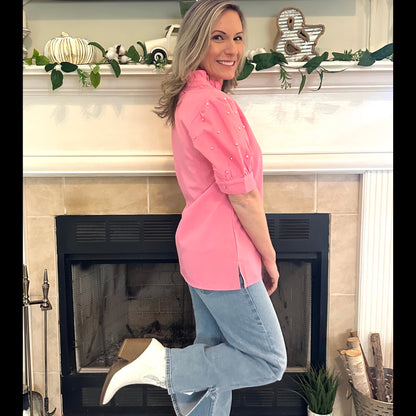 sophisticated choice for any occasion. Featuring puff sleeves with delicate embellishments and a split neckline.
