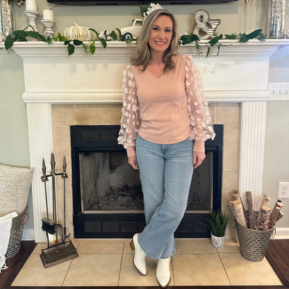 Floral Sleeve Top brings a touch of elegance and charm to your wardrobe. Designed with sheer puff sleeves adorned with 3D floral appliqués and a soft V-neckline.
