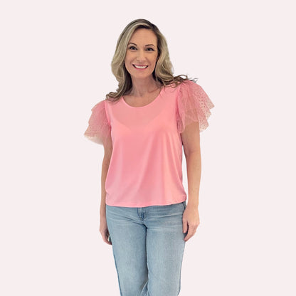 Pink Ruffle Sleeve Top is a fun and feminine piece that adds a playful touch to any outfit. Featuring delicate polka-dot mesh ruffle sleeves and a soft, lightweight fabric.