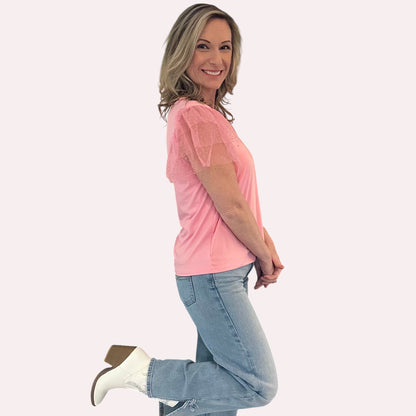 Pink Ruffle Sleeve Top is a fun and feminine piece that adds a playful touch to any outfit. Featuring delicate polka-dot mesh ruffle sleeves and a soft, lightweight fabric.