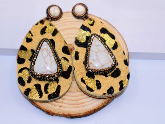 Teardrop earrings combined with bold leopard print and luxurious faux leather. 